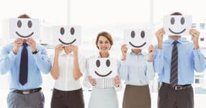 How to attract more clients. Happy clients with smiles drawn on paper