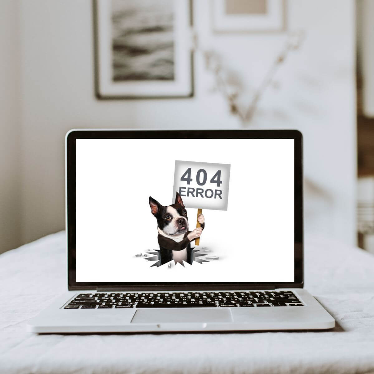 Website Repair - Laptop computer with a dog holding a sign that says 404 error